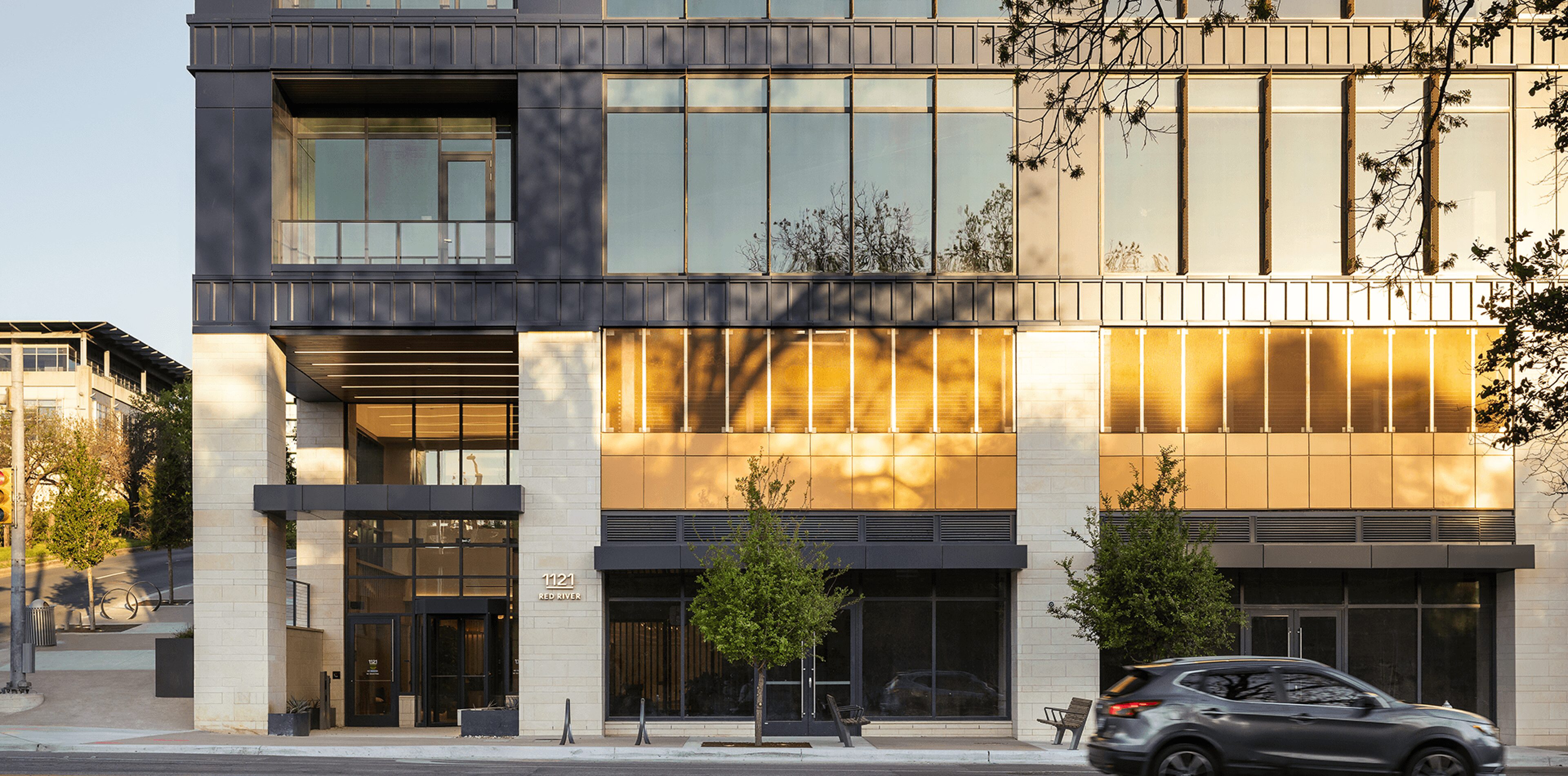 Modern building facade with reflective glass windows.